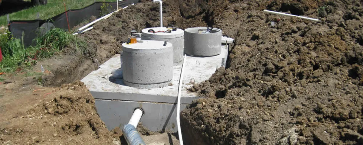 Septic system repair and installation site with tank access ports in Lafayette, LA